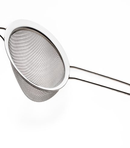 Metallic colander for cooking (kitchenware collection). Isolated on white background.