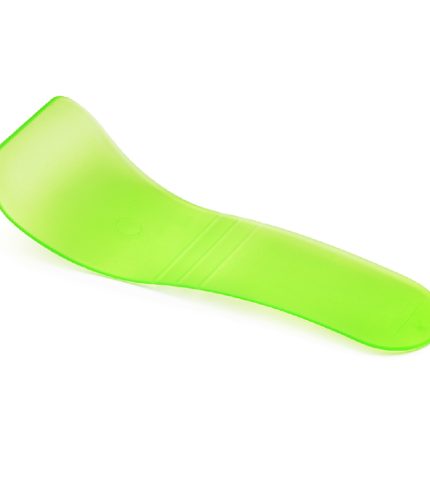 Green plastic cosmetic hair wax removal spatula isolated on white